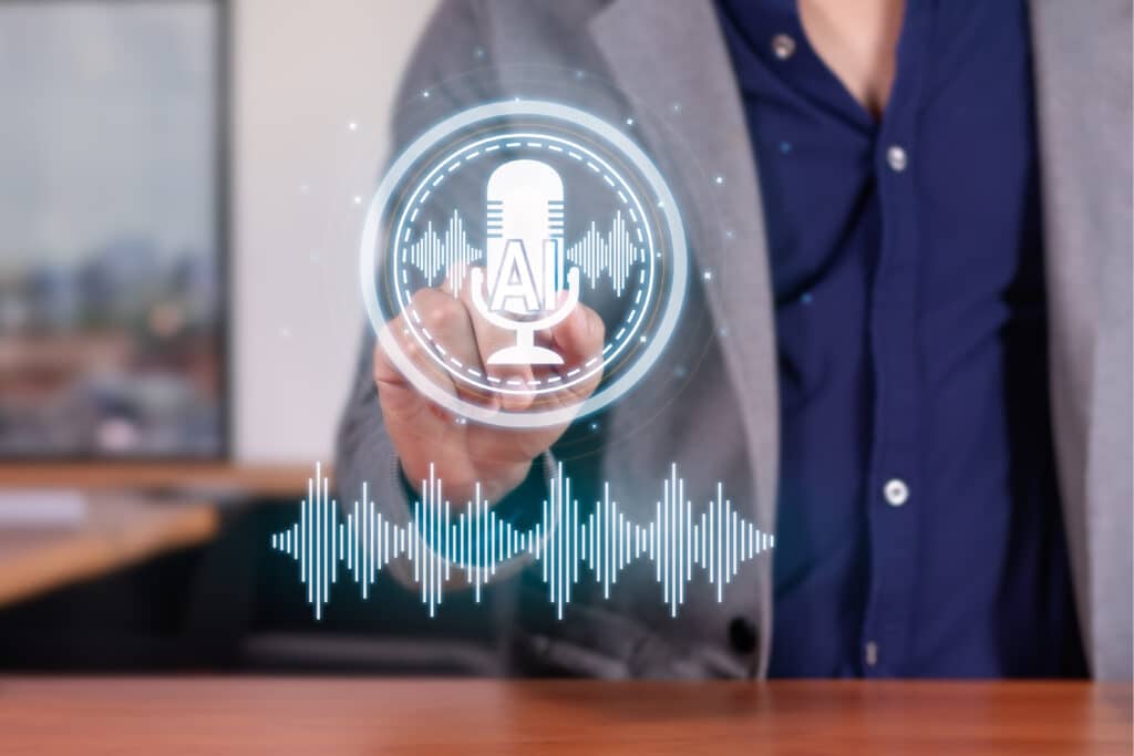 A person in a suit touches a virtual interface displaying a microphone, "AI," and sound waves, indicating the use of text-to-speech software