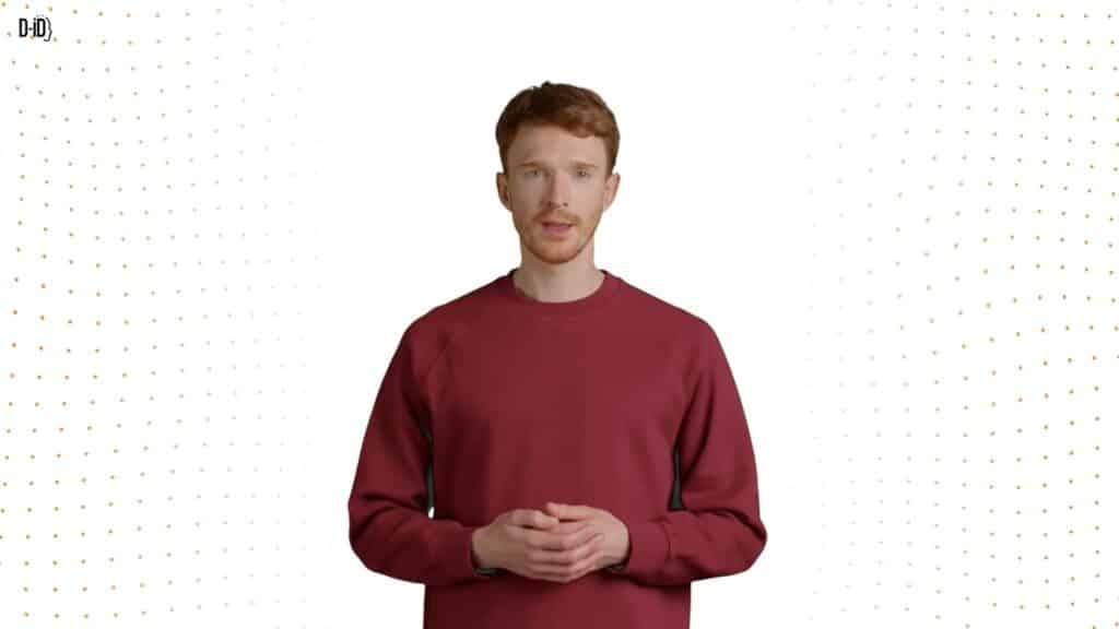 A person with short red hair and a beard, wearing a maroon sweatshirt, stands against a white background with small orange dots on the sides, ready to present a Video Campaigns Walkthrough.