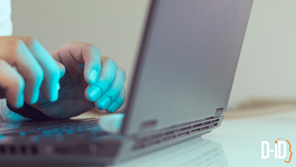 Close-up of hands typing on a laptop keyboard with the D-ID logo visible in the bottom right corner, illustrating work on generative ai agents.
